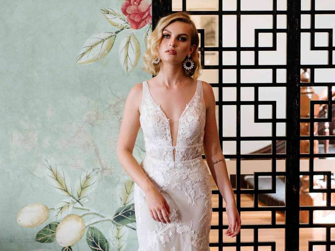 Model wearing a white gown