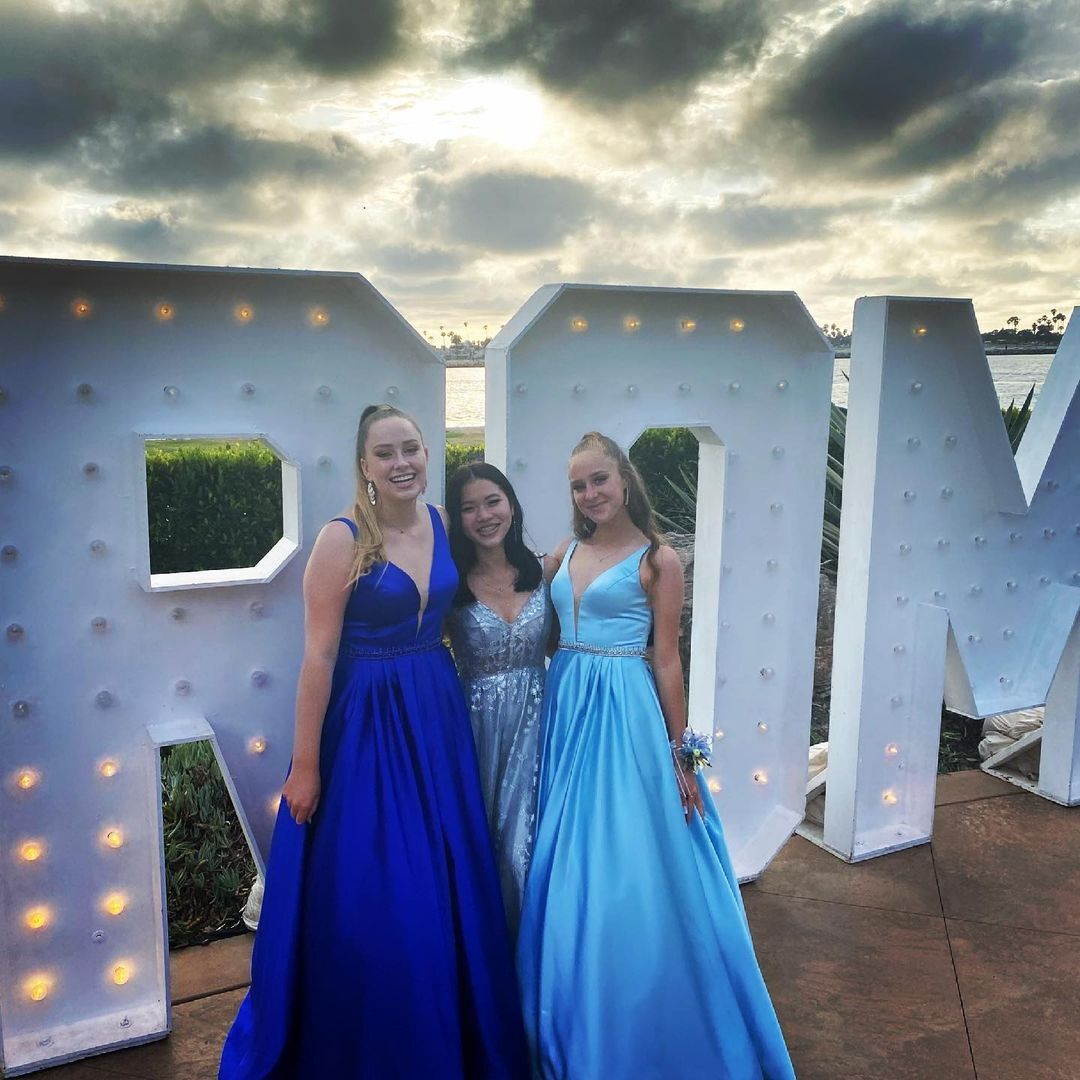 Models wearing a blue gowns