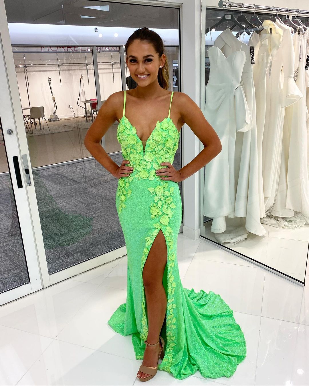 Model wearing a green gown